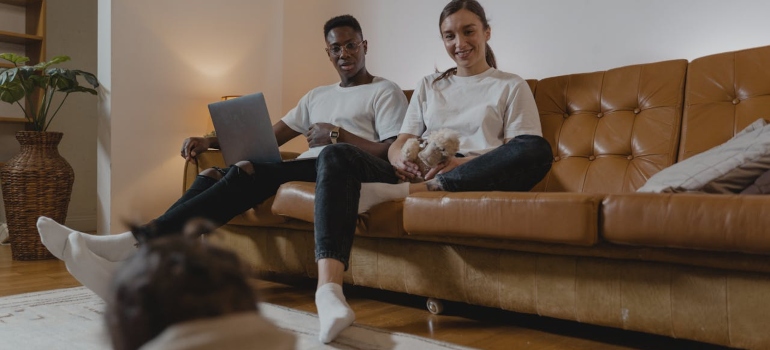 a man and woman sitting on the couch