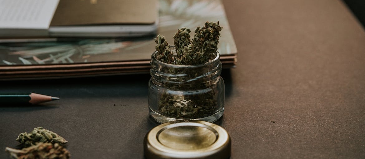 A glass and weed inside it.