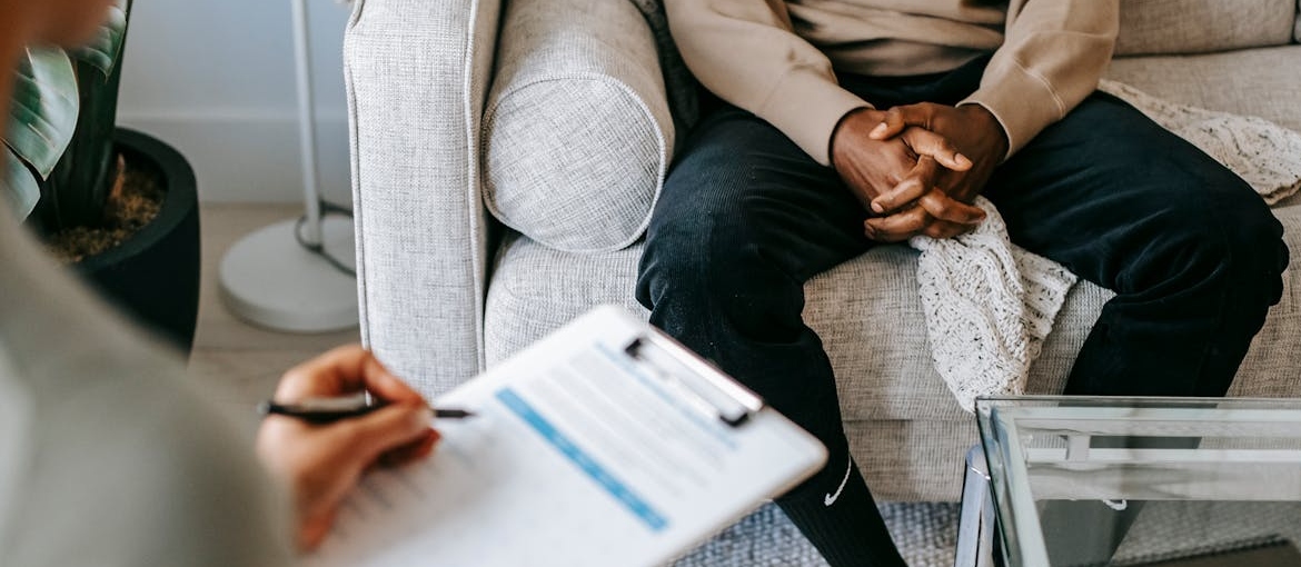 Therapist talking to a patient about how to keep your private life and career while in rehab.