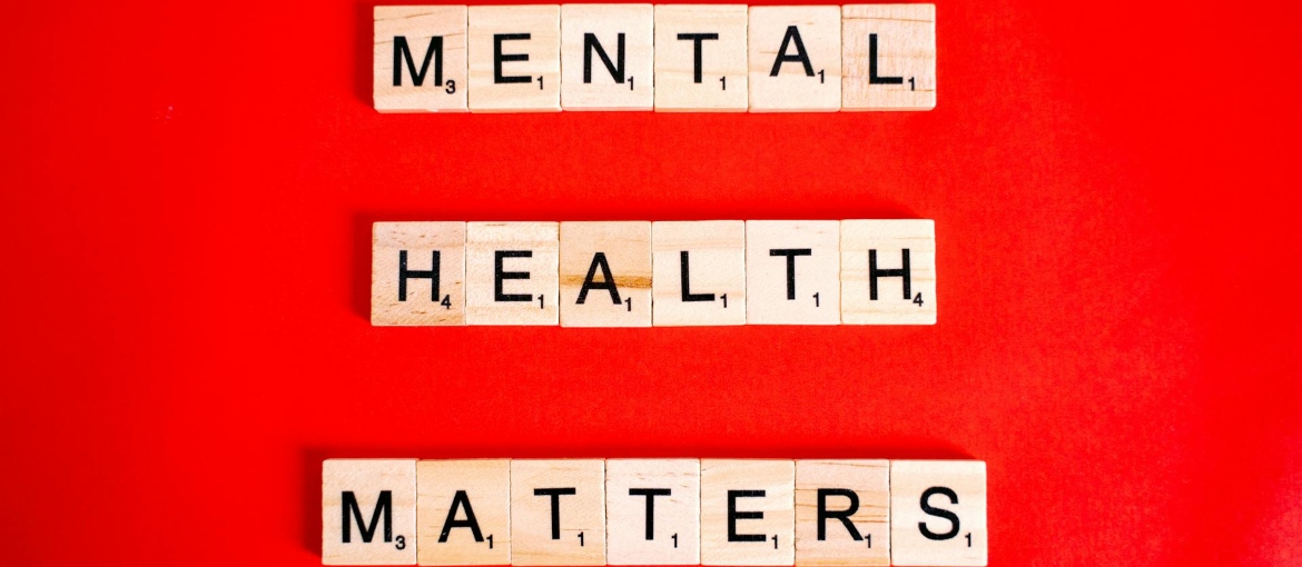 Mental Health Matters Spelled on Letter Tiles on Red Background