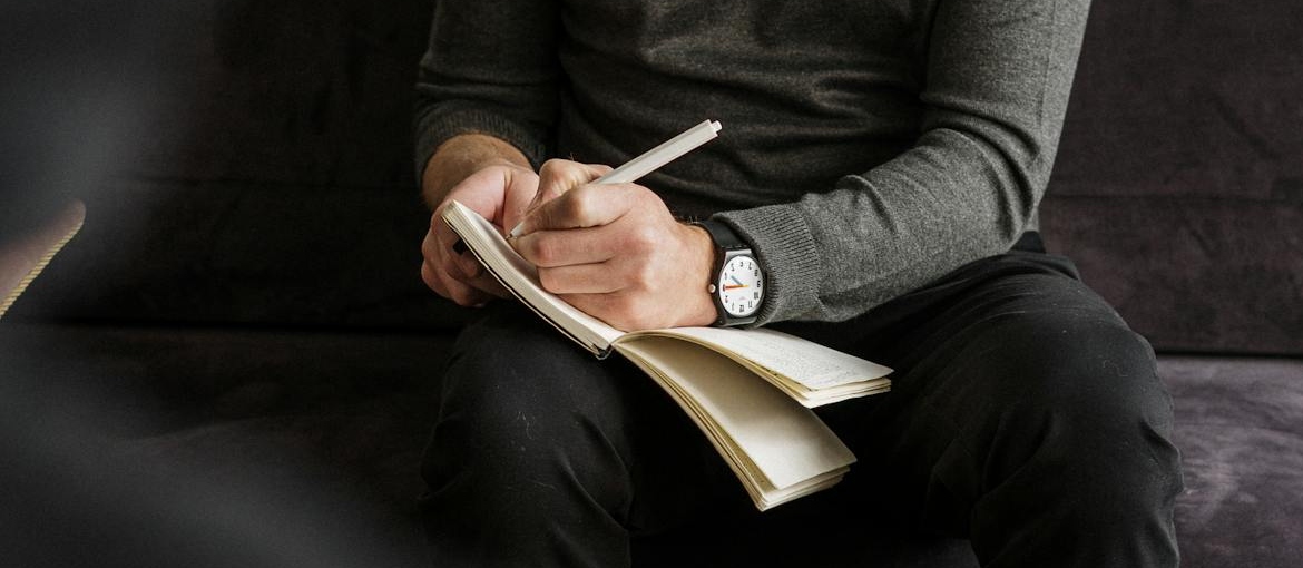 Therapist writing down notes.