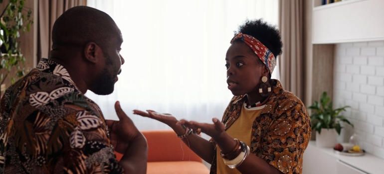 a man arguing with woman about co-parenting with drug addicted