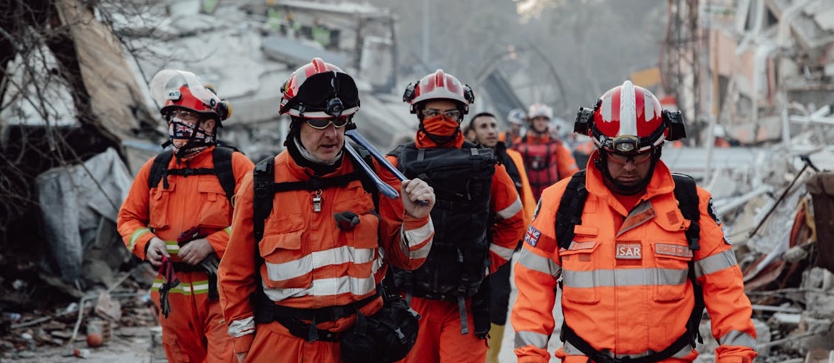 Paramedics in a demolished city.