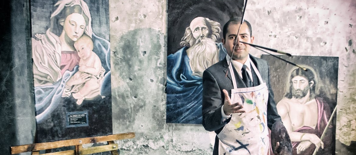 Man throwing paint brushes.