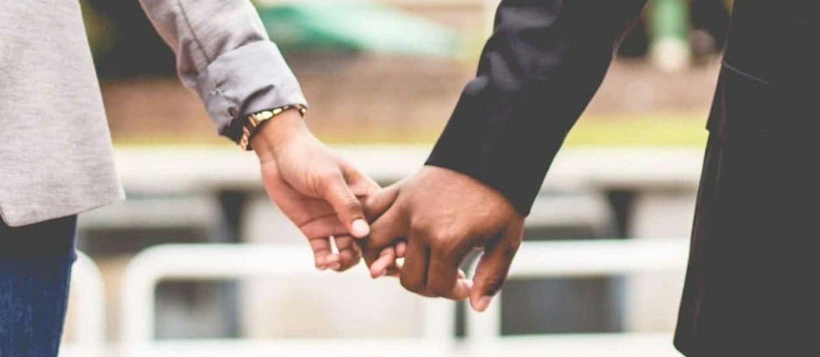 Two people holding hands.