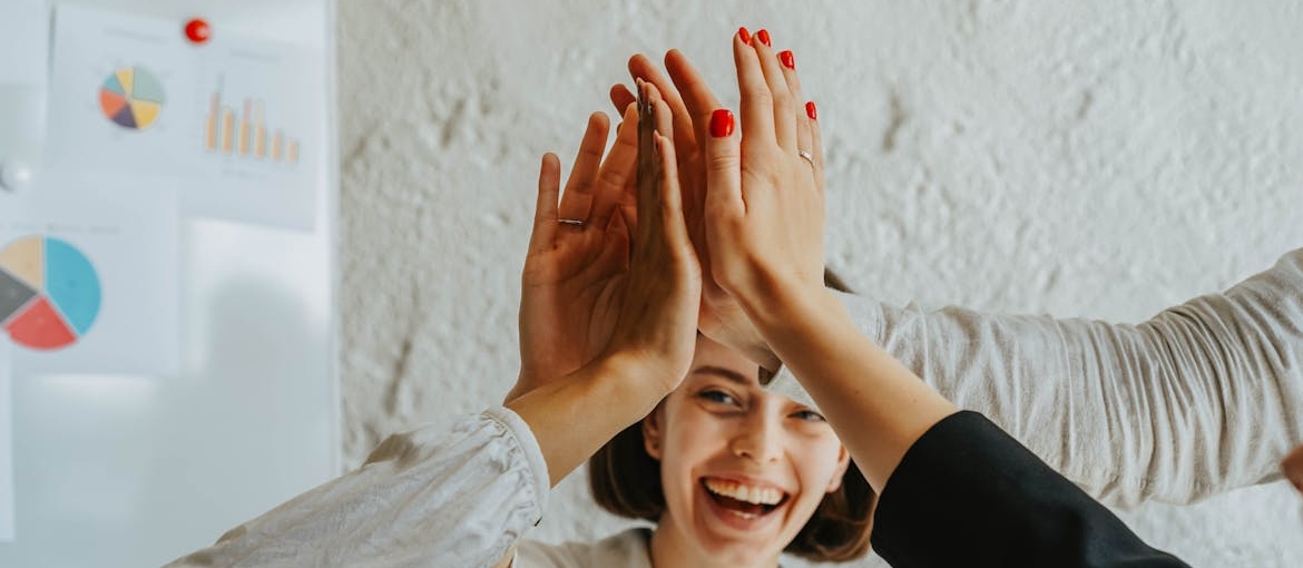 Women in a support group cheering to each other