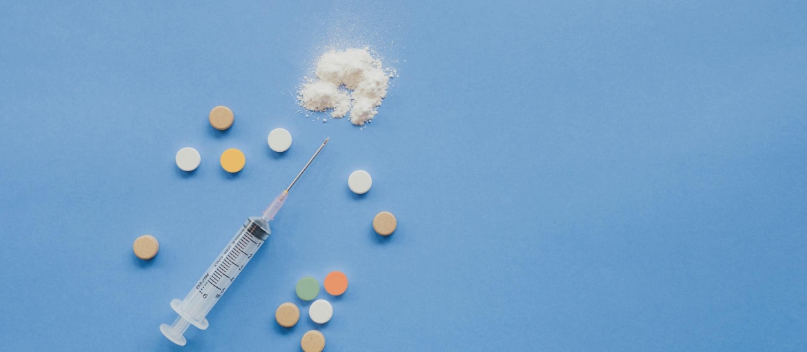 top view of syringe with pills