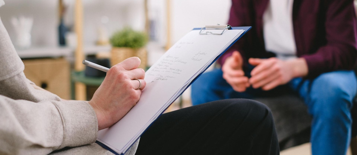 a therapist and a patient discussing PHP vs Inpatient options