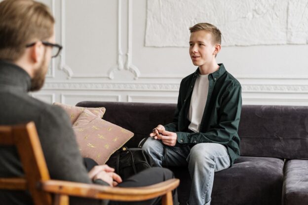 Young man attending motivational interviewing for teens.