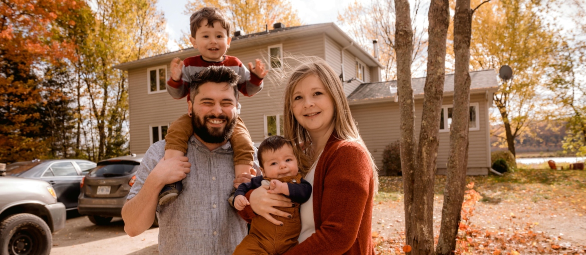 Photo of family smiling.