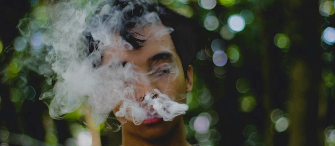 A man covered with smoke.