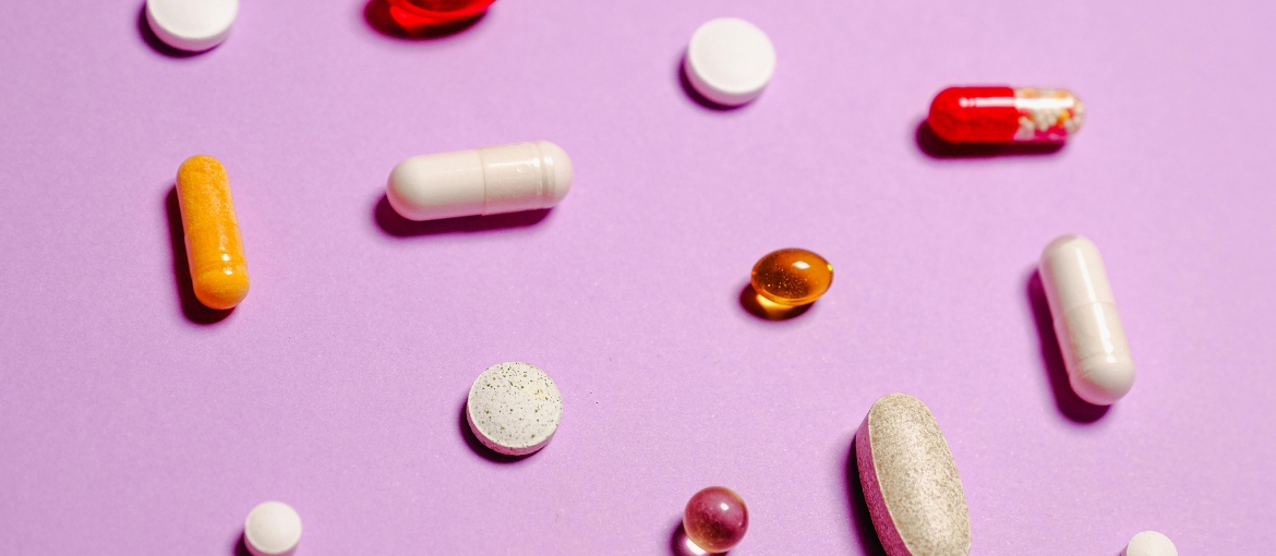 Red, white and yellow medication pills.