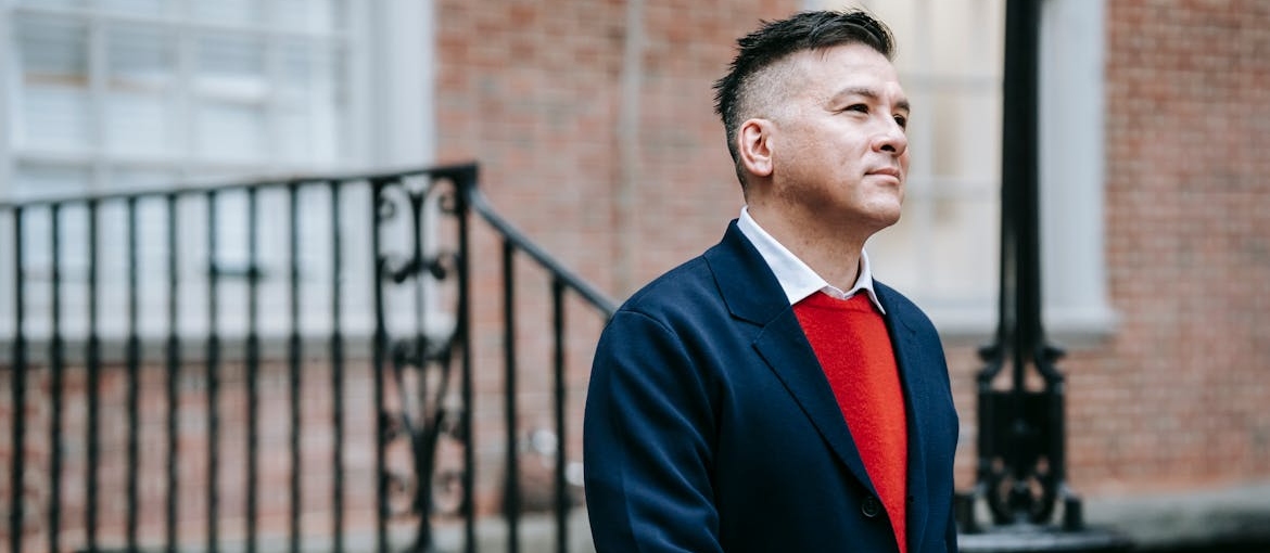 A person in a navy blue blazer going to work after cocaine addiction treatment