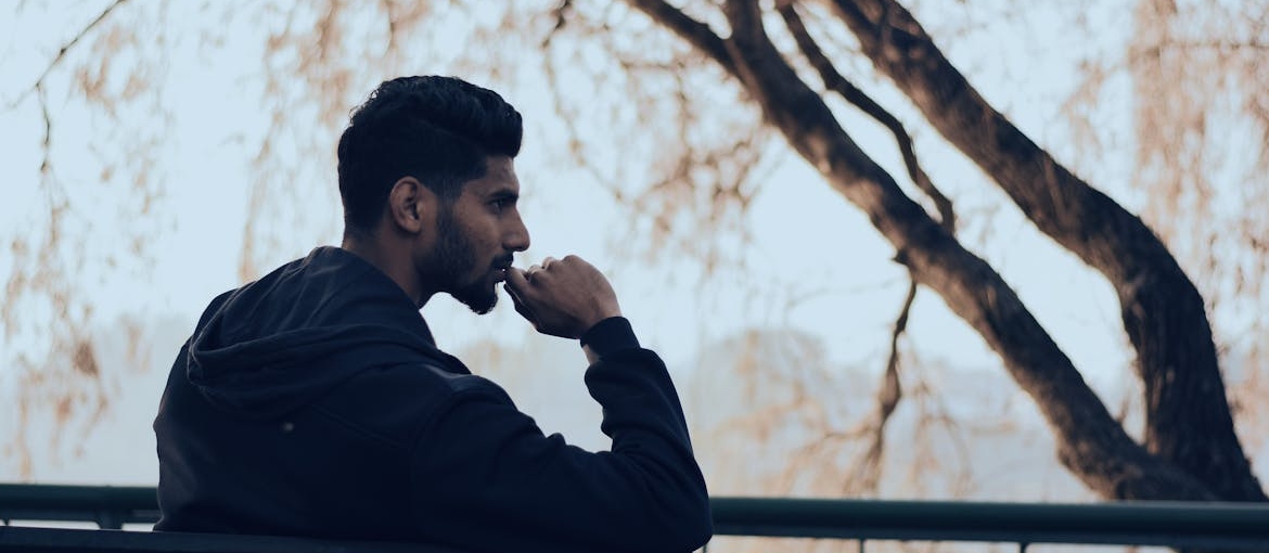 Man sitting on a bench and thinking.