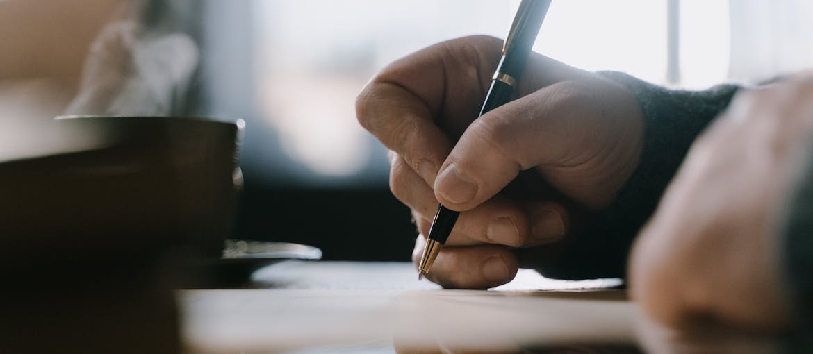 Person writing a letter.