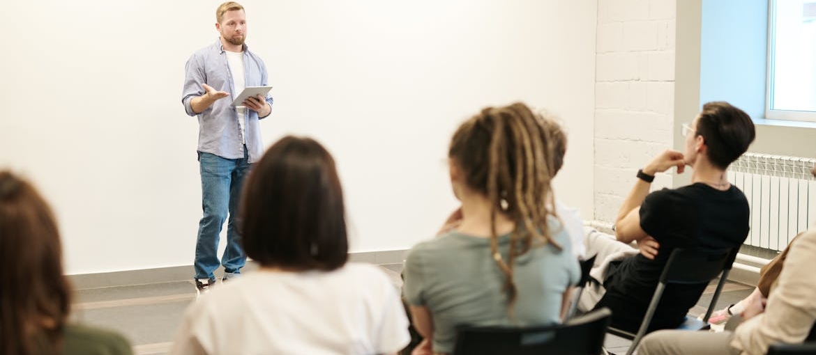 Man doing a lecture on alcohol use disorder during alcohol awareness month.