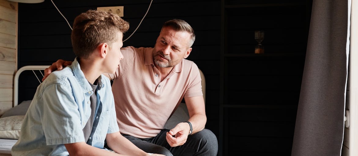 Man talking to his son and trying to support a teen who’s just completed rehab.