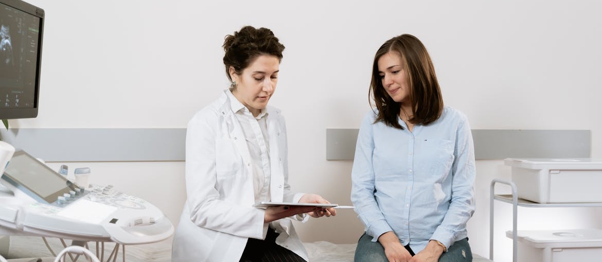 Woman talking about being pregnant and hiding an addiction with her OB-GYN.