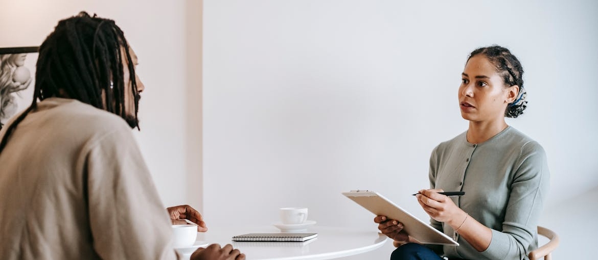 Man explaining his issues with religious trauma and addiction to his therapist.