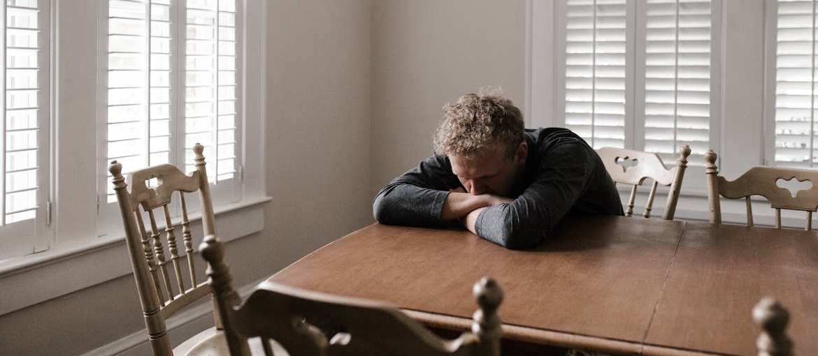 Man experiencing depression because of religious trauma and addiction.