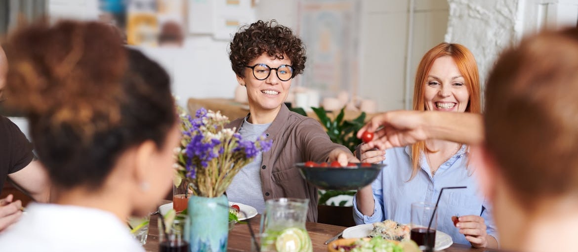 People having dinner to celebrate with their friend.