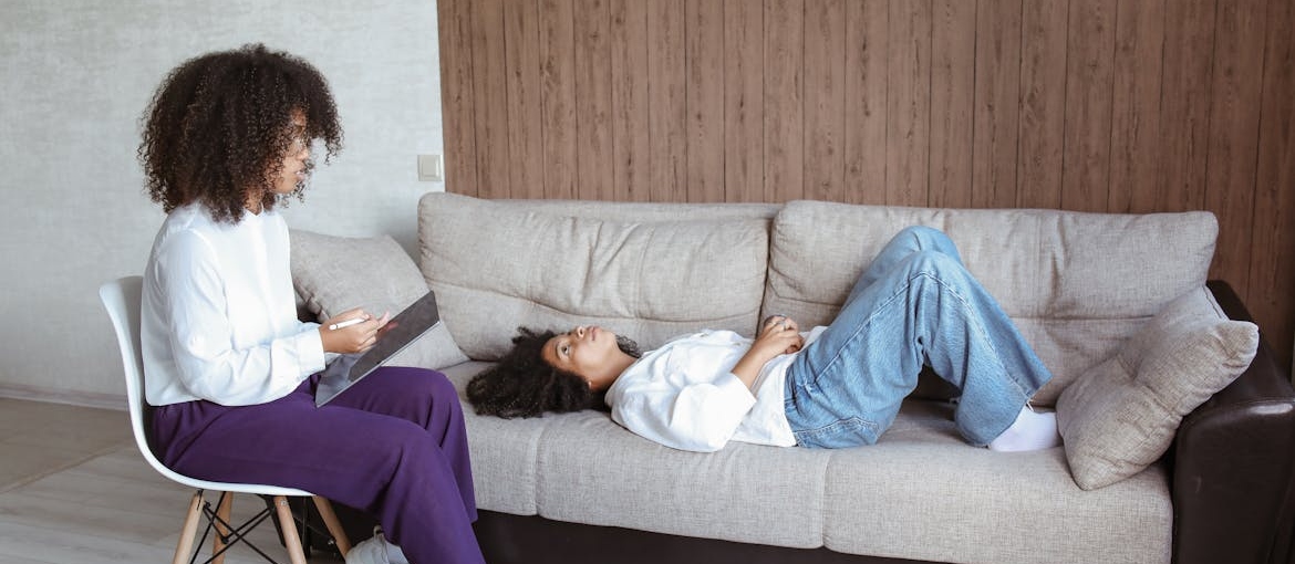 Therapist talking about long-term addiction recovery with her client.