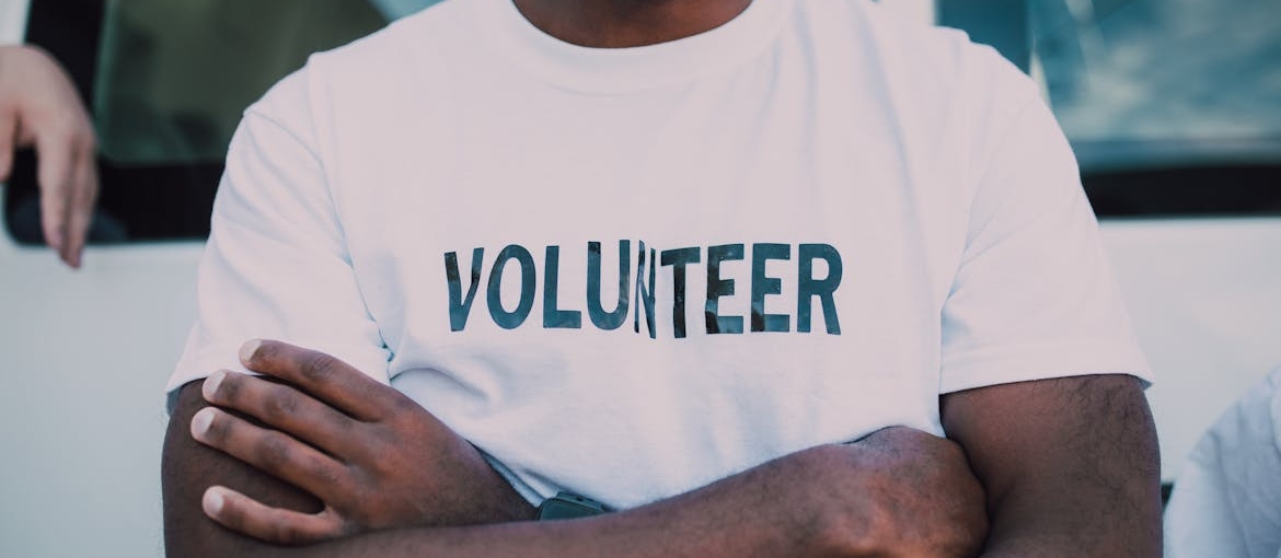 Volunteer crossing his arms.