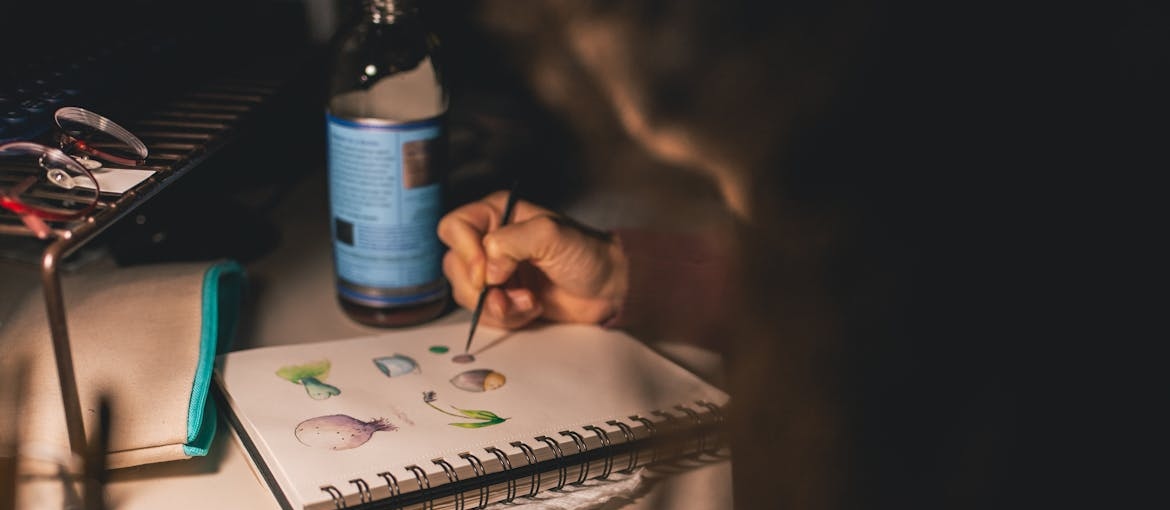 Woman painting with watercolors.