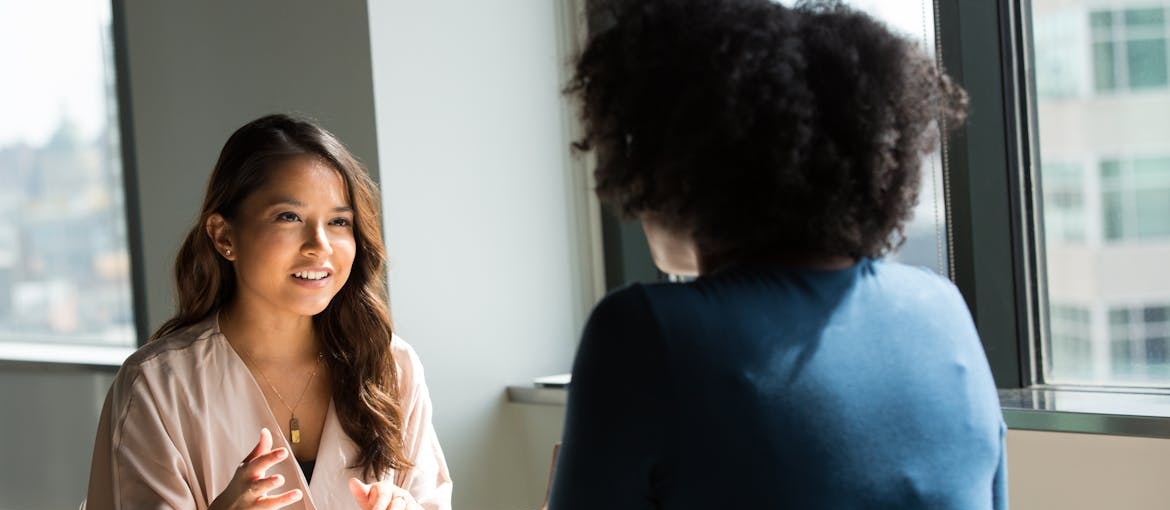 Two women having a conversation.