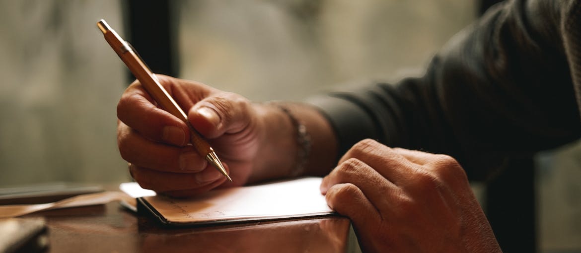 Parent of addicts writing a letter to their child.