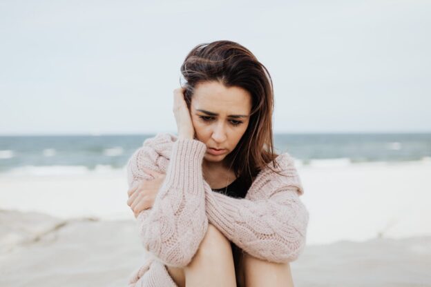 Woman experiencing seasonal depression in summer.