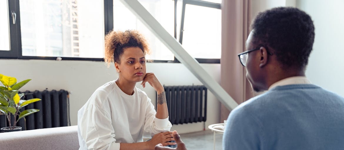 Man setting boundaries with his daughter in a serious conversation.