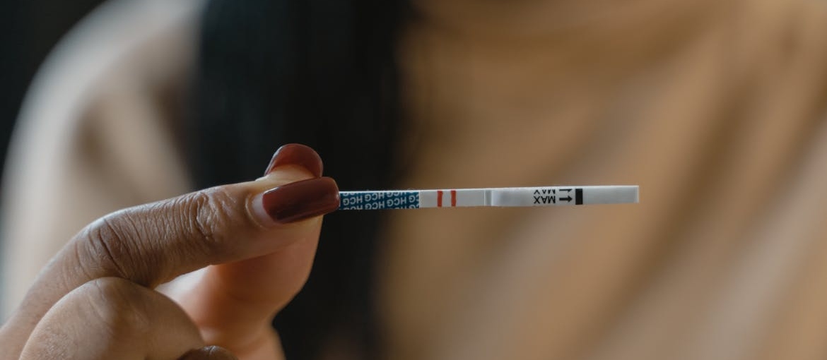 Person holding a fentanyl strip test.