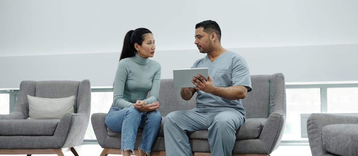 Doctor talking about what are blues drugs with his patient.