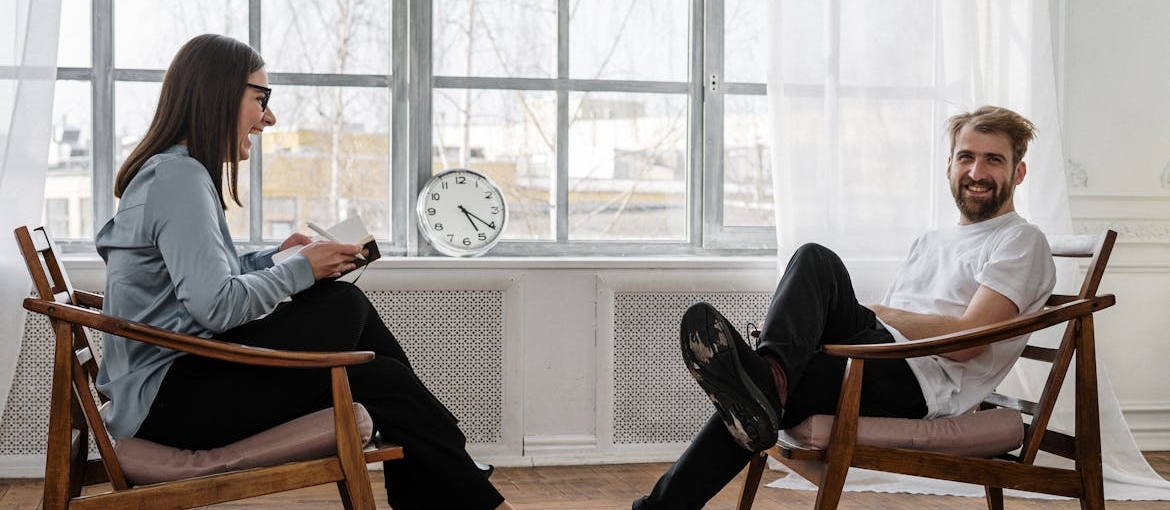 Man talking about life after inpatient rehab with his therapist.