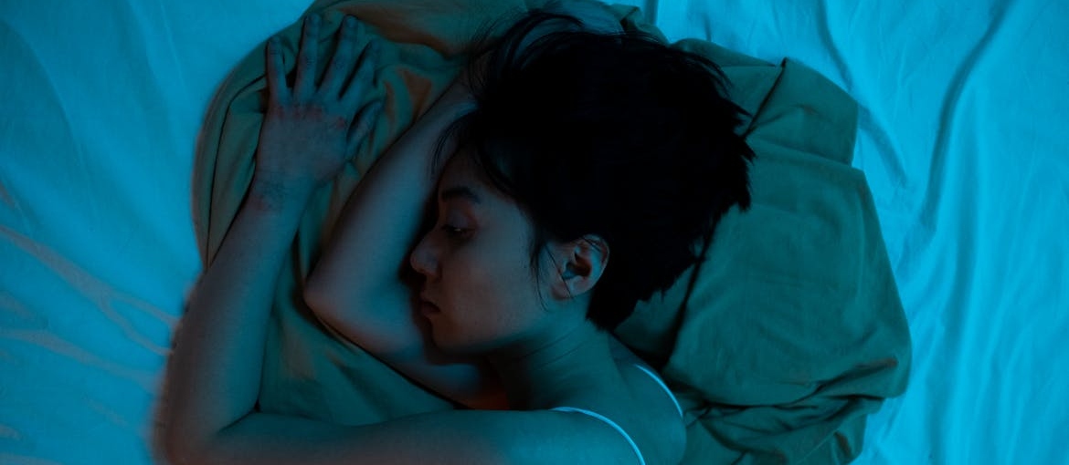 Woman sleeping soundly, one of the benefits of quitting weed.
