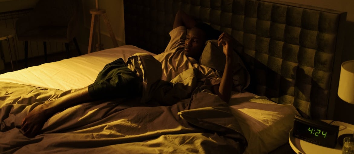 Man experiencing insomnia.