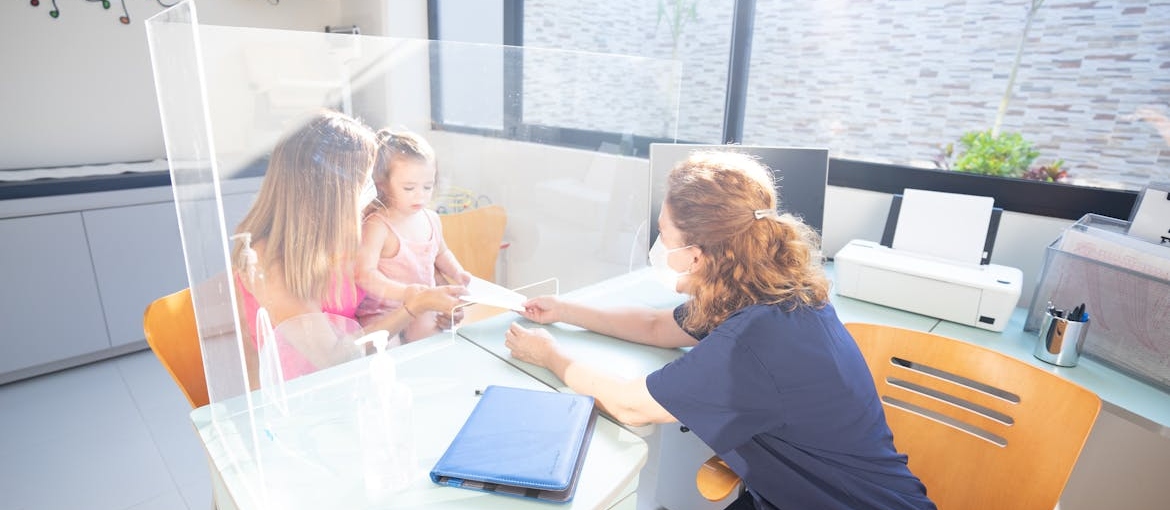 Mother and daughter at a doctor's appointment.