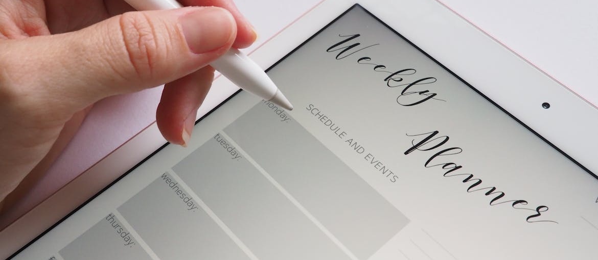Person planning sober vacations on their tablet.