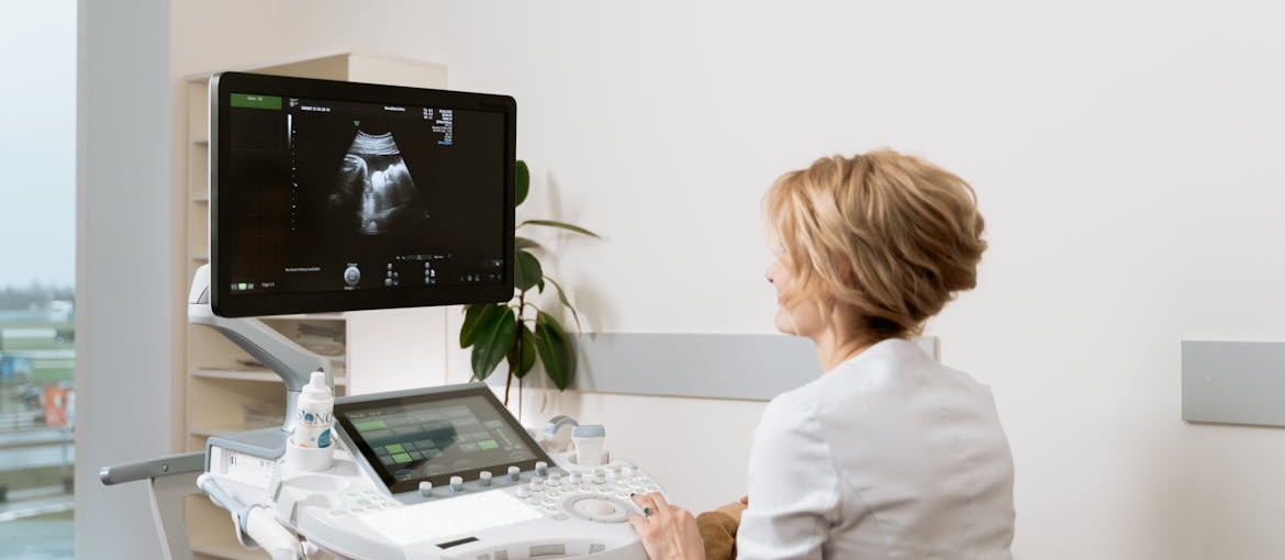 Doctor looking at a sonogram.