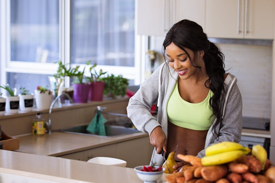 Woman making a fruit salad in her kitchen.