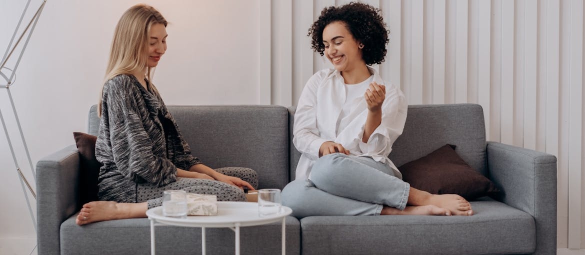 Two women discussing coping skills for addiction.