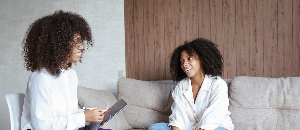 Therapist talking about the benefits of quitting weed with her patient.