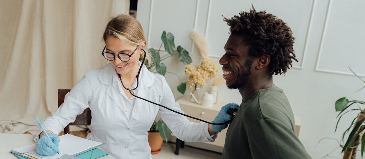 Doctor doing a medical checkup on a man.
