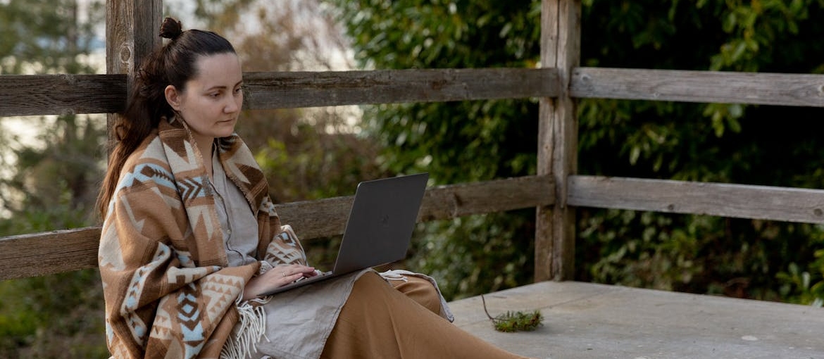 Woman researching Buprenorphine vs Suboxone on her laptop.