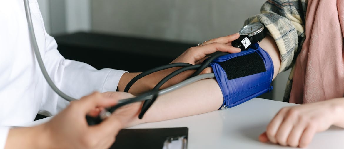 Person getting their blood pressure checked out.
