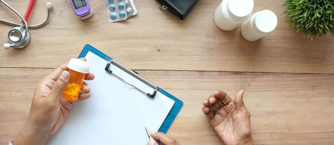 Doctor prescribing medications to a patient in detox.