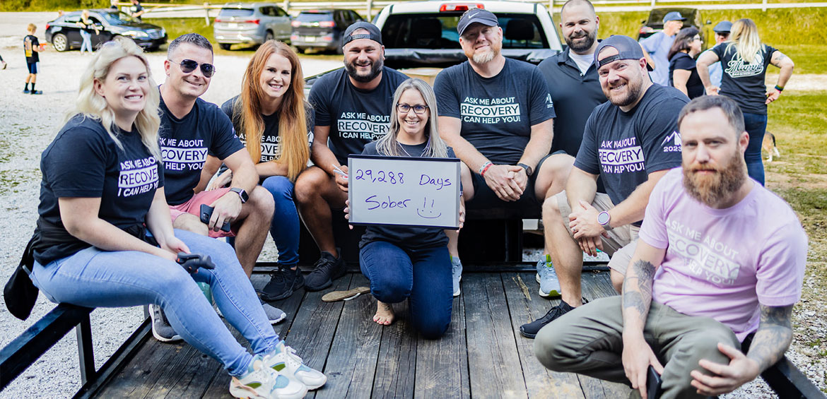 a group of people in harmony tshirts