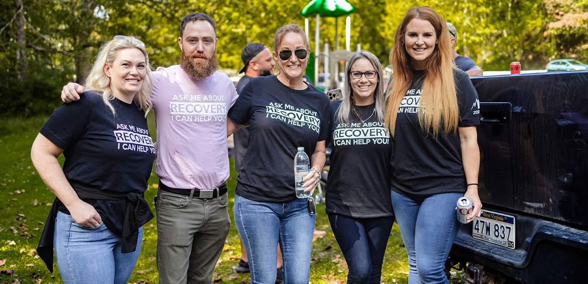 four people in harmony tshirts