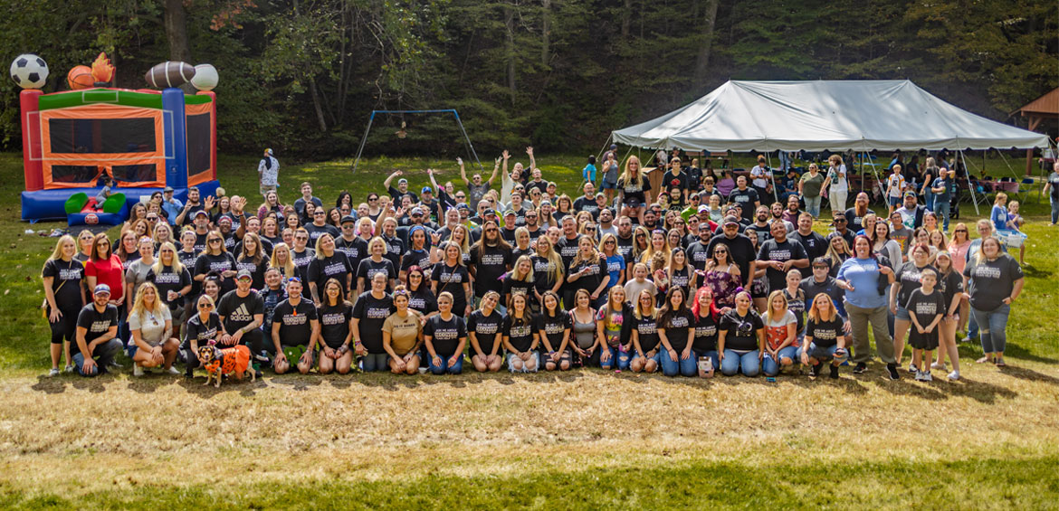 a large group of people wearing harmony thirts